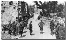 Italian troops in a town on the Isonzo front